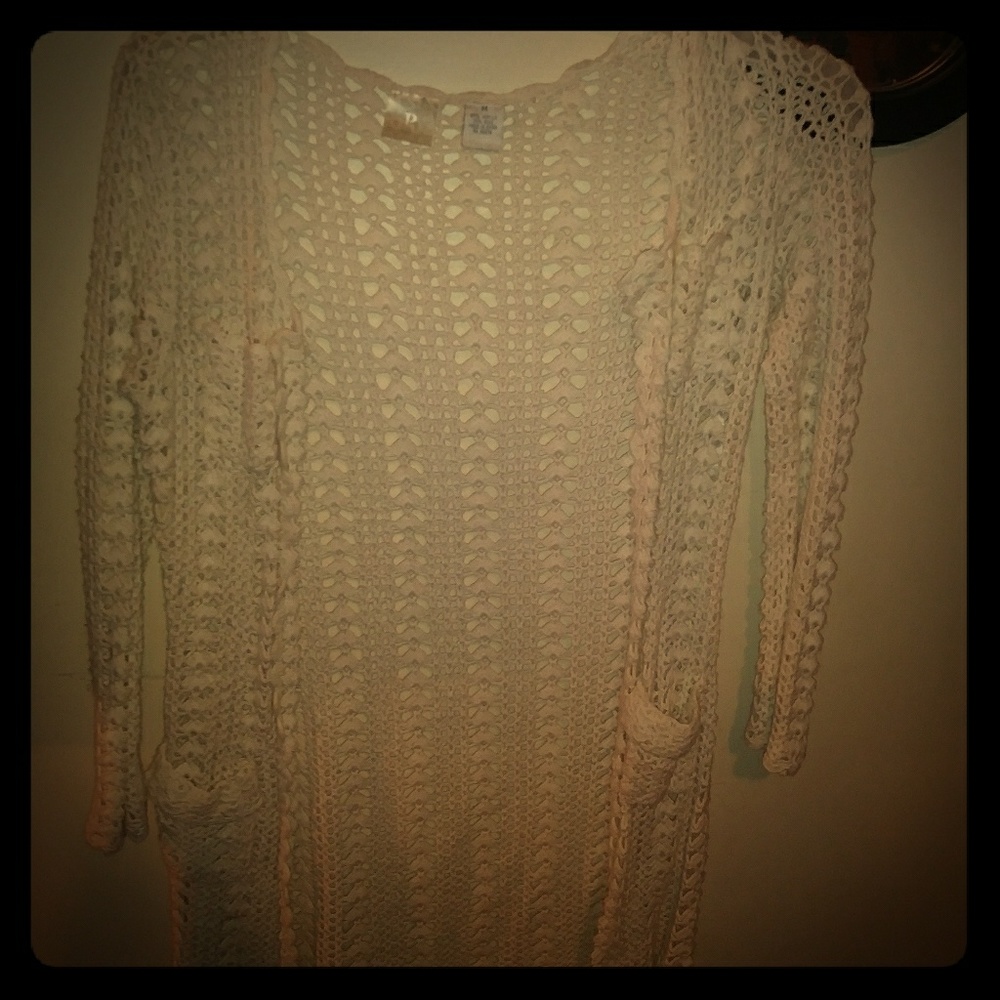 Long creme colored knit sweater
